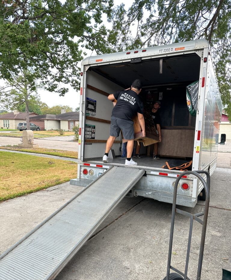 Professional team members carrying a heavy item in Katy, Texas.
